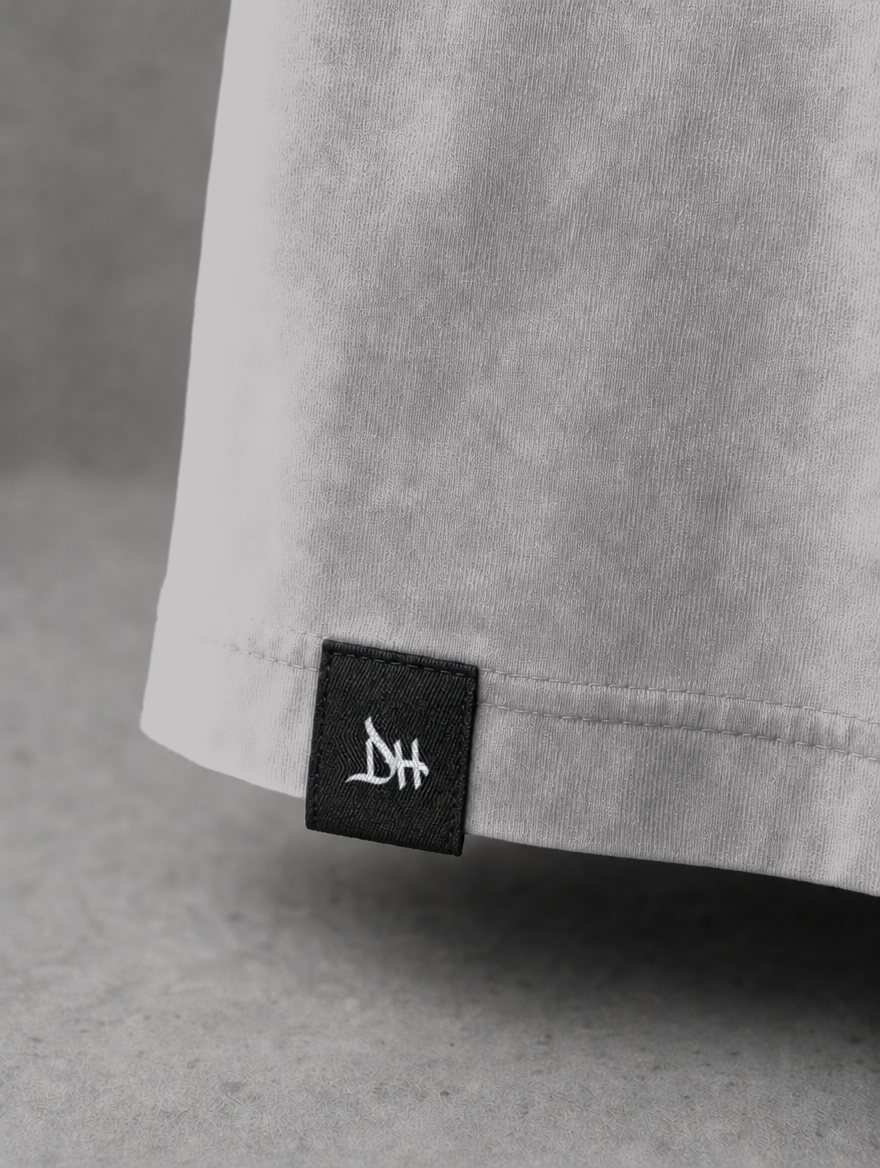 Woven DH label on the hem. Concept render.
